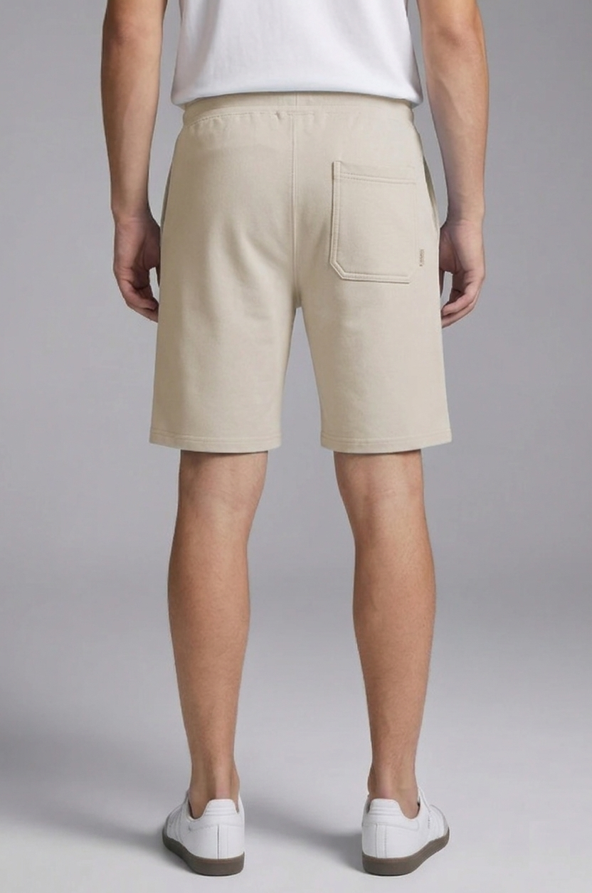 Beige: Solid Shorts